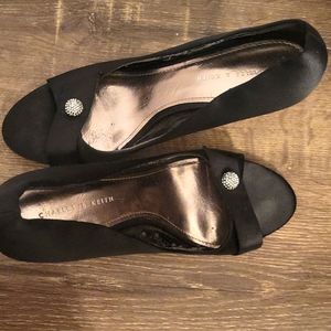 Black Satin peak toe pumps